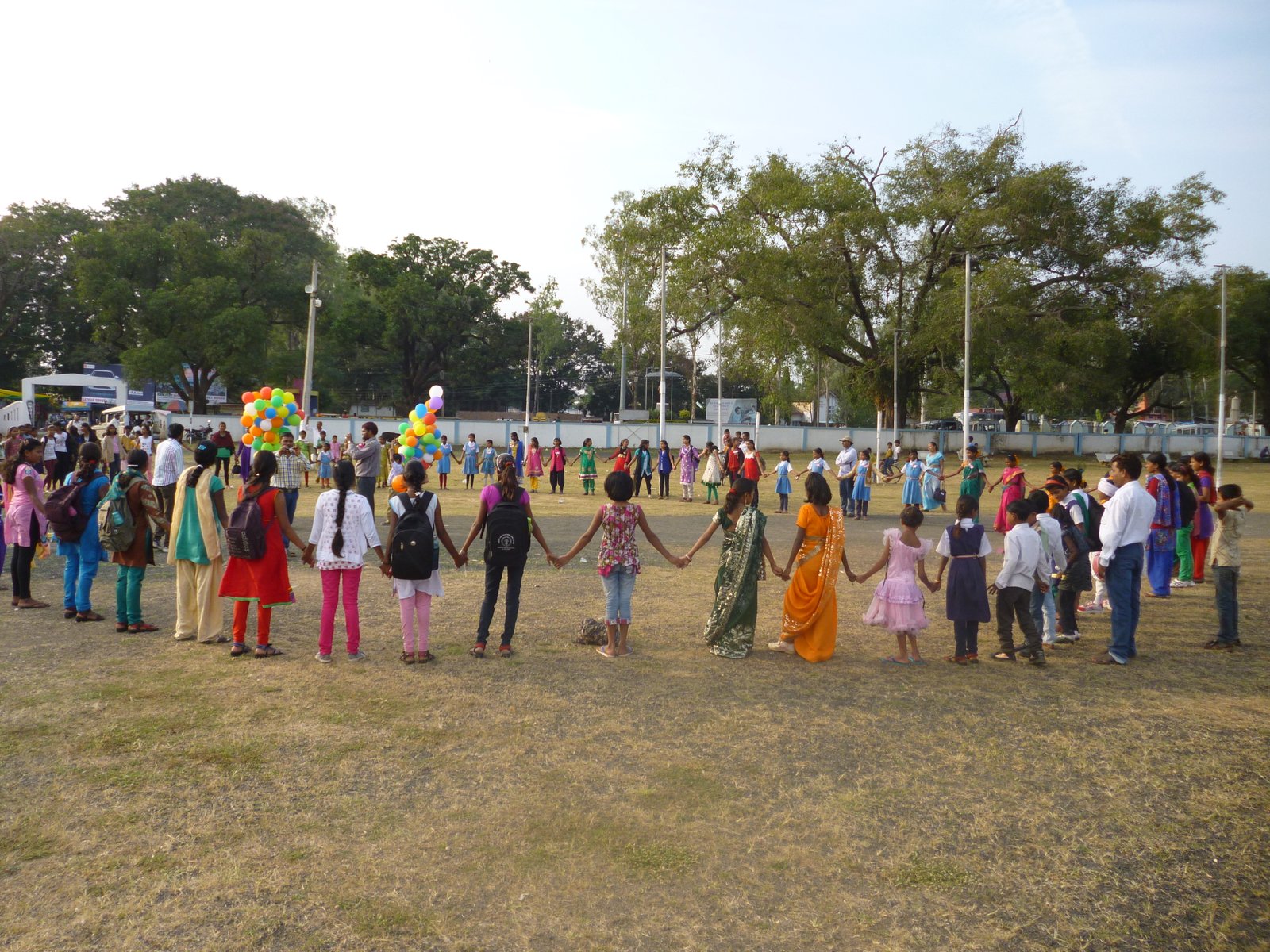 Children holding hands at child rights event